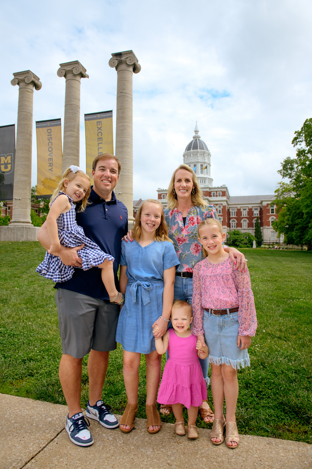 MU Football Coach Eli Drinkwitz and family stand in front of the Mizzou Columns and Jesse Hall in Columbia, Missouri. 