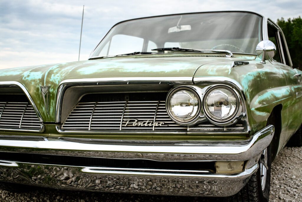 Front of Pontiac Catalina car with headlights and grill.