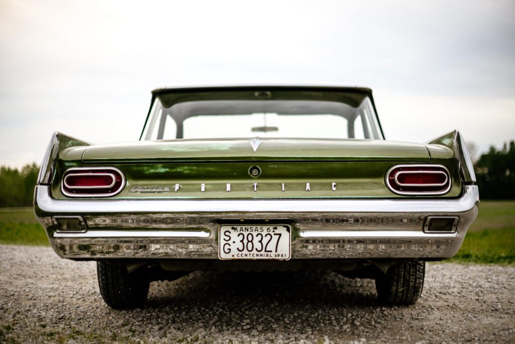 Tail lights and bumper shot of green pontiac catalina.