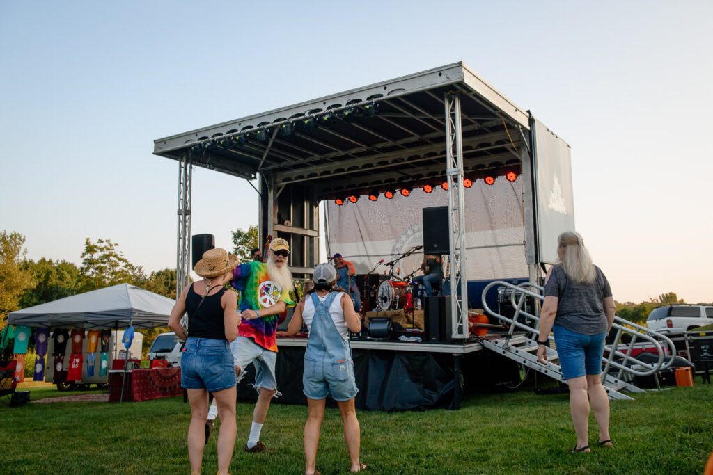 man dances in front of stage