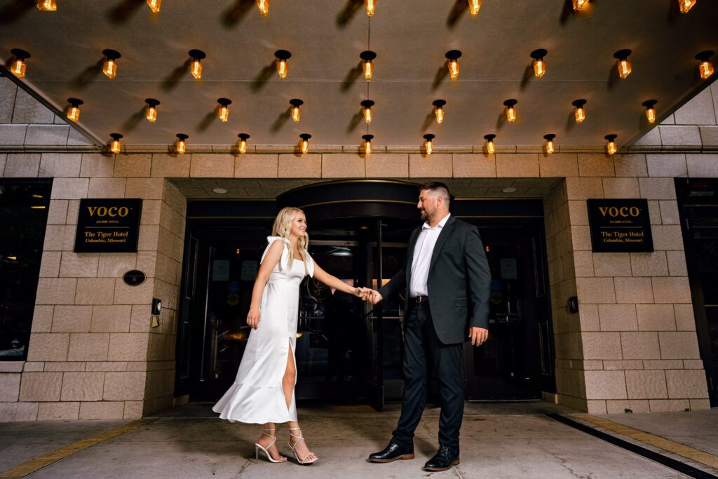 Couple dance under the tiger hotel awning in Columbia, Missouri.